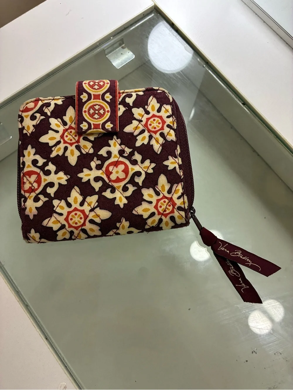 Vera Bradley Bifold Square Zip Wallet Has pink staining on back of wallet shown